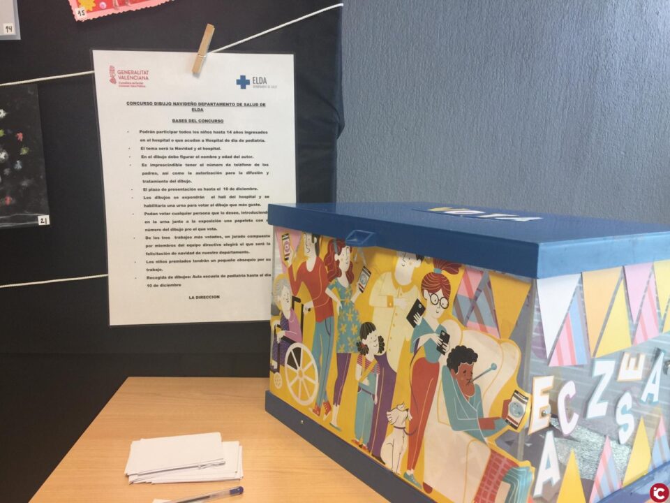 Bases del concurso que se ha instalado en el hall del Hospital de Elda para elegir la felicitación navideña del Departamento